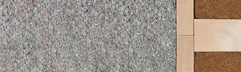 Verschiedene Dämmmaterialien sind nebeneinander angeordnet, um deren Struktur und Zusammensetzung zu zeigen.